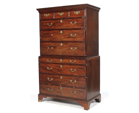 A Georgian mahogany secretaire chest on chest. With oak front to back drawer linings, adjustable rake and secret drawer to th