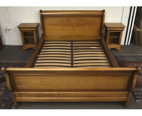 A modern cherry wood finish double bed frame and pair of matching bedside cabinets. Bed with a NF Ameublement label. L148cm x