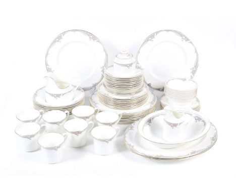 A Royal Doulton eight place 'NOVA h 5113 (1986)' pattern dinner service. Comprising eight cups and saucers, eight dinner plat
