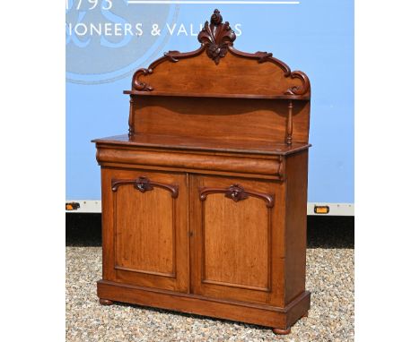 A Victorian carved mahogany chiffonier with raised back over a cushion moulded drawer and panelled cupboards 114 x 40 x 160 c
