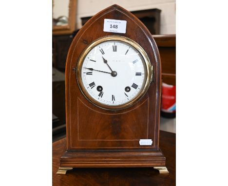 An Edwardian lancet shaped eight-day mantel clock with enamel dial, striking on a coiled gong to/w pendulum and keys, 30 cm h