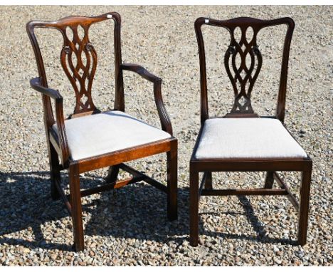 A set of eight Chippendale style mahogany dining chairs with cream pads by Stephen Thorne (2 carvers and 6 side chairs) 