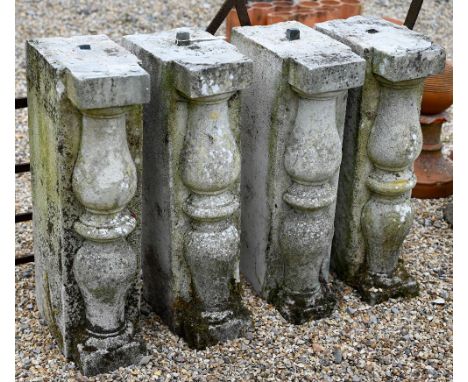 A set of four reclaimed architectural cut stone balustrade blocks with decorative column fronts, 70 am h (4) 