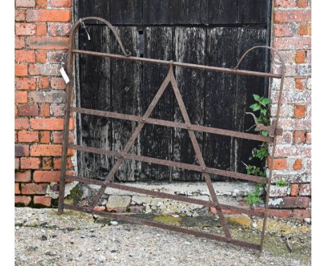 An antique weathered wrought iron estate gate 