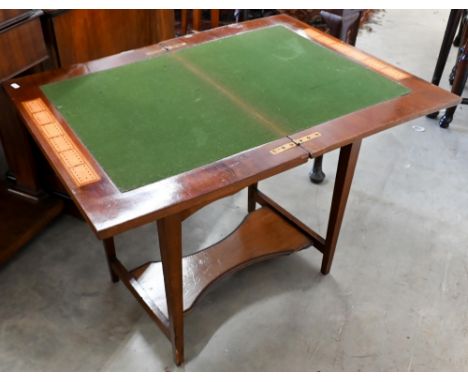 An Edwardian walnut bridge/card table with rotating baize lined folding top and end drawer, 60 cm wide x 40 cm deep x 64 cm h