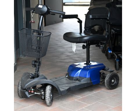 An electric mobility scooter c/w charger, key and manual -charged and ready 