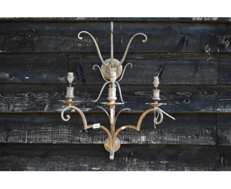 A large scrolling metal three-sconce wall light, 65 cm high 