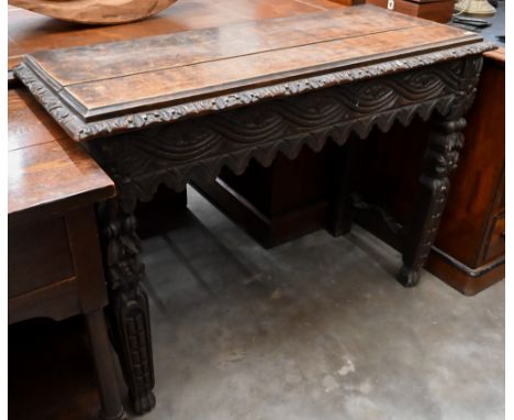 A continental carved oak console table, 104 x 42 x 78 cm high 