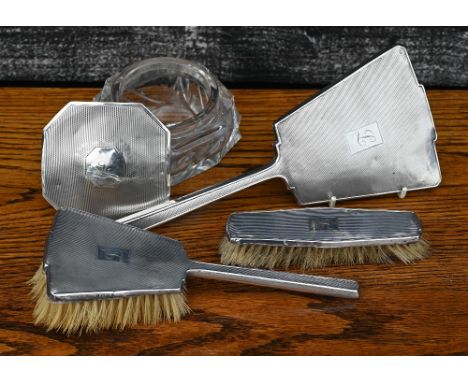 A silver-mounted four piece toilet set including brushes, mirror and bowl, Birmingham 1936, to/w a pair of vintage leather ri