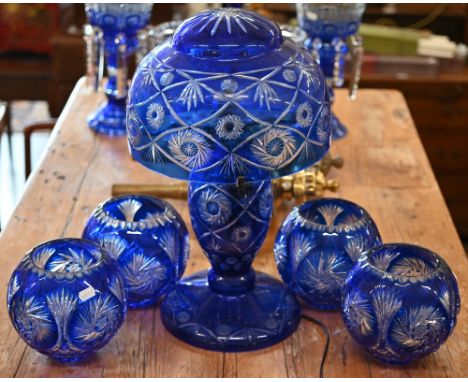 A blue flash glass table lamp with bowl shade, 50 cm high to/w a set of four similar globular bowls (5) 