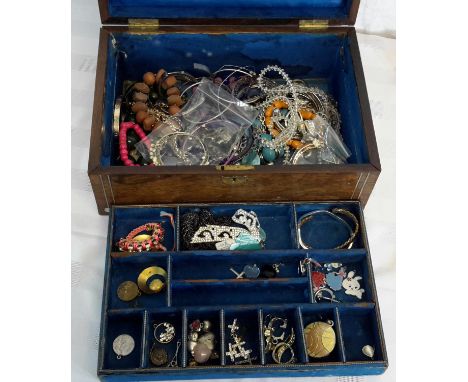 A Victorian jewellery box with mother of pearl inlay. Box is full of costume jewellery.