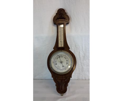 British made oak cased barometer thermometer. 58cm in height.