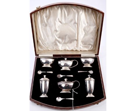 1930s six piece silver Art Deco-style cruet set, comprising pair salts of shaped rectangular form, with blue glass liners, on