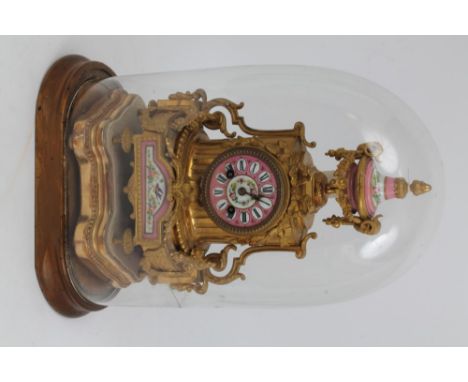 Ornate mid-19th century French gilt metal and porcelain mantel clock with urn surmount, pink porcelain dial and panels painte