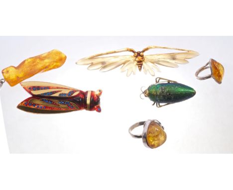French Art Nouveau carved horn insect brooch with original steel pin, together with another insect brooch with gilded wings i