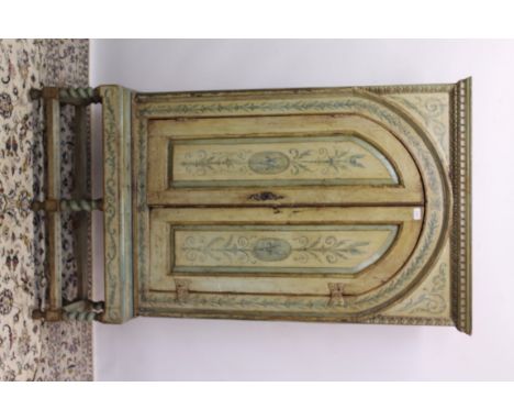 Polychrome painted cabinet on stand with dentil cornice and enclosed by a pair of arched fielded panel doors enclosing shelve
