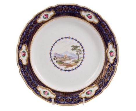 Early 19th century Derby plate with central painted landscape with figures, ornate gilt and blue borders with painted flower-