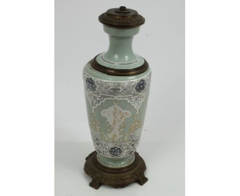 Late 19th century Islamic Market Celadon porcelain and gilt brass mounted oil lamp / electric lamp base with Islamic script a