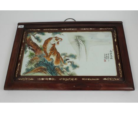 Chinese porcelain rectangular panel painted with a tiger in branches, in hardwood frame, 46cm x 70cm overall CONDITION REPORT