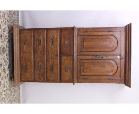 Late 19th / early 20th century teak two height campaign-style cabinet, the upper section with pair of arched panel doors encl