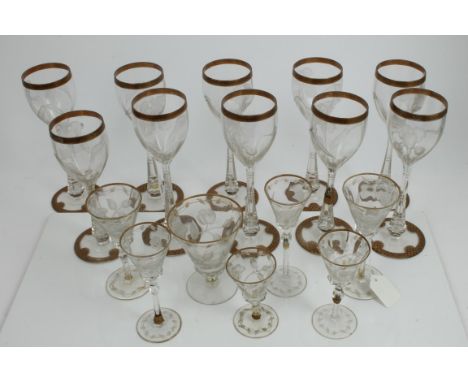 Collection of good quality early 20th century Art Nouveau wine glasses, with engraved Iris decoration to bowls and gilt rims,