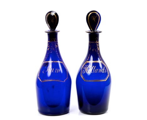 Pair George III Bristol blue decanters with pear-shaped stoppers and gilt line labels 'Hollands' and 'Rum', with chain and ri