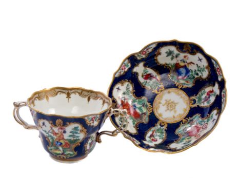 Rare 18th century Worcester two-handled chocolate cup and saucer of ogee form, finely painted with chinoiserie figures playin