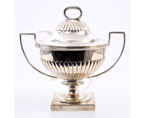 Late Victorian silver twin-handled sauce tureen of circular form, with fluted body and gadrooned border, on pedestal foot wit