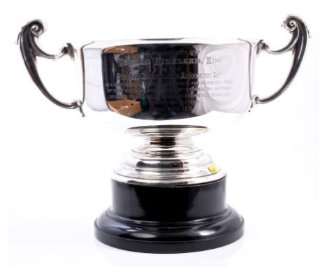 Early George V silver two-handled trophy cup of cauldron form, with flared rim, engraved presentation inscription and scroll 