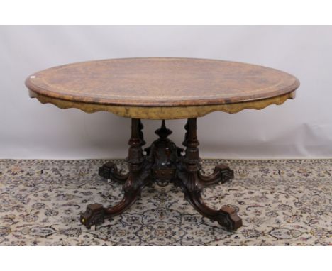 Good Victorian figured walnut and parquetry inlaid loo table, the well figured quarter veneered moulded tilt top with inlaid 