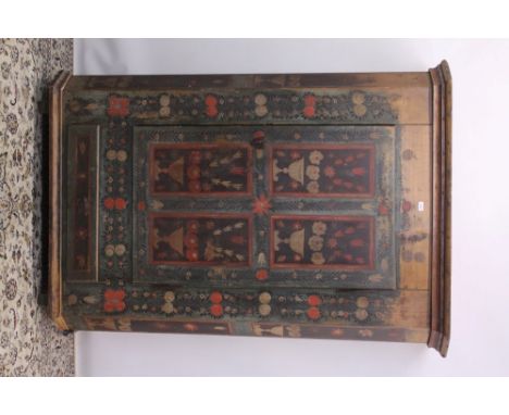 19th century Continental polychrome painted pine armoire enclosed by cupboard door and drawer below between canted angles on 