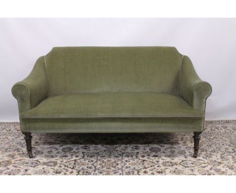 Edwardian two seater sofa, green upholstered, raised on turned legs and castors CONDITION REPORT Dimensions - 146cm wide x 74