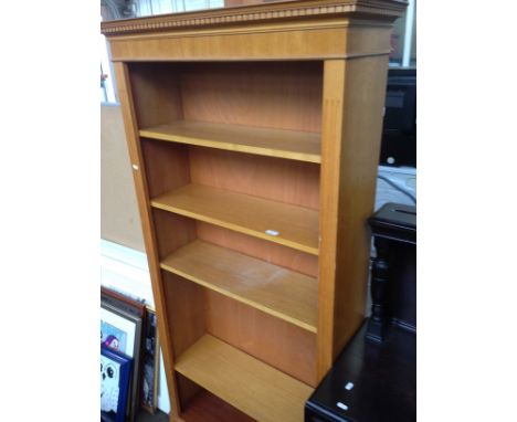 A MODERN LIGHT OAK BOOKCASE