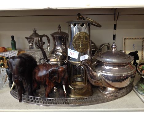 A TRAY OF EPNS ALSO INCLUDING A MINER'S LAMP AND 3 ELEPHANTS. K4