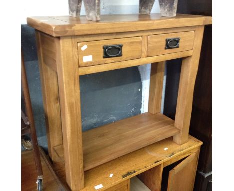 A MODERN LIGHT OAK TWO DRAWER SIDE TABLE. L85CM D35CM H76CM