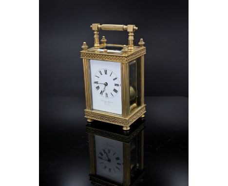 A gilt-brass carriage clock, enamelled dial signed Ollivant &amp; Botsford, Manchester, Paris Maker, unsigned French movement