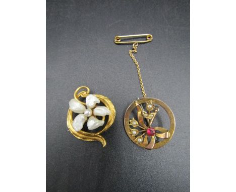2 9ct gold brooches, one with mother of pearl flower with seed pearl centre and the other with garnet and seed pearl flower, 