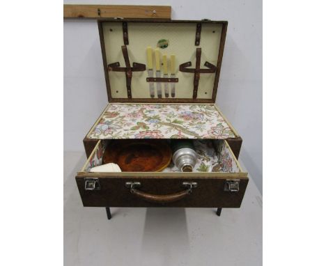 A 1950's picnic hamper with sprung legs by Garrison Witesmore