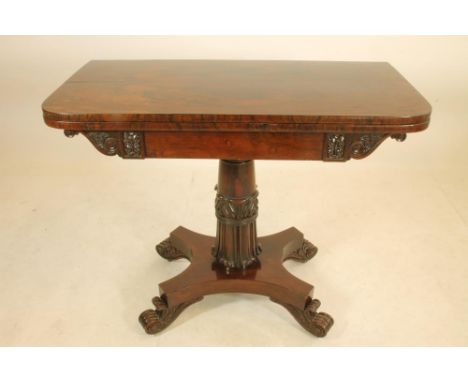 A REGENCY ROSEWOOD FOLDING CARD TABLE, early 19th century, of rounded oblong form, the swivel top opening to green baize line