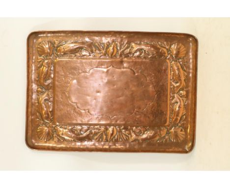 AN ARTS AND CRAFTS NEWLYN COPPER TRAY, c.1900, of plain rounded oblong form, the central vacant shaped panel on a planished g