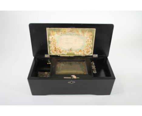 A CONTINENTAL MUSICAL BOX, 19th century, the comb and 4 1/2" drum movement playing six airs, ebonised wood case with marquetr