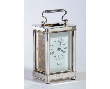A SILVER CASED CARRIAGE CLOCK, retailers Ogden of Harrogate, Sheffield 2006, the single barrel movement with platform escapem