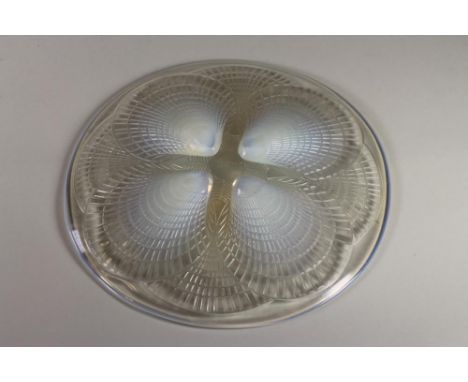 A LALIQUE BLUE OPALESCENT GLASS PLATE in "Coquilles" pattern, marked "R. Lalique, France", and numbered 3010, 10 1/2" diamete