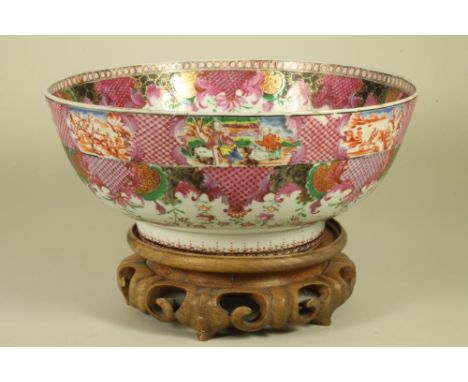 A CHINESE EXPORT PORCELAIN BOWL, mid 18th century, of plain circular form painted in famille rose enamels with diapered scrol