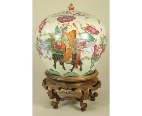 A CHINESE PORCELAIN JAR AND COVER of ovoid form, painted in polychrome enamels with a procession of children playing drums an