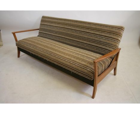 A SCANDINAVIAN DESIGN TEAK FRAMED SOFA BED, 1960's, upholstered in ivory, tan and blush tweed, shaped open arms on splayed su