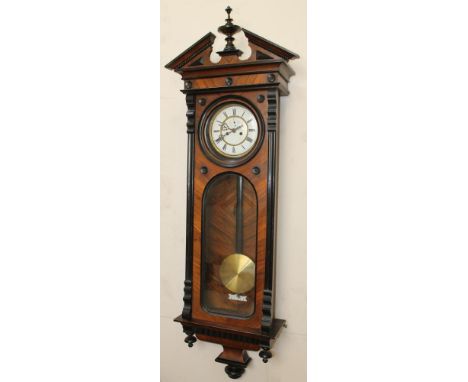 A GERMAN WALNUT CASED TIMEPIECE, the double weight drum movement stamped HE &amp; Co Schutz Marke 21925, 7" two piece white e