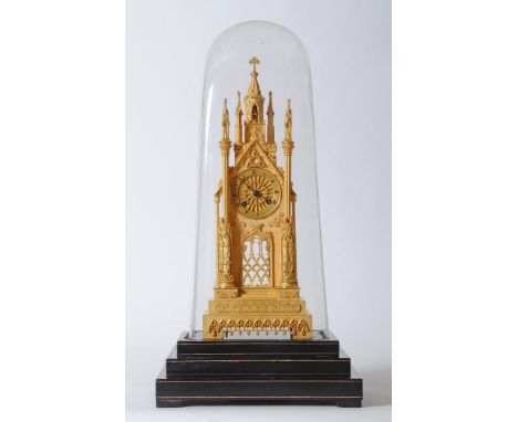 A GILT METAL STRIKING CATHEDRAL CLOCK, signed Dent, 82 The Strand, the twin barrel movement with outside count wheel striking