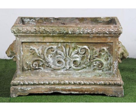 A STONEWARE PLANTER, 19th century, of oblong panelled form with laurel wreath moulded rim, the long sides with scroll work ce