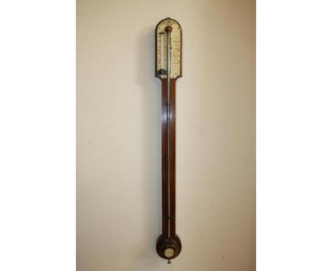 A ROSEWOOD STICK BAROMETER signed Bennett, Cheapside, London, with thermometer, arched top with ivory register, turned cister